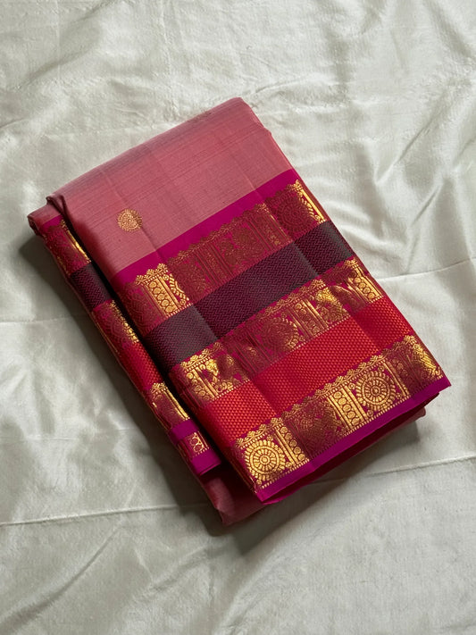 Pure Kanchipuram Silk Saree – Pink Body, Royal Purple Korvai Borders
Annapakshi zari stripes & paisley buttas • contrast purple blouse
Silk Mark Certified • Fall & Pico Done • Blouse Stitching Available ($30)
Free Shipping within USA ships in 2 weeks
