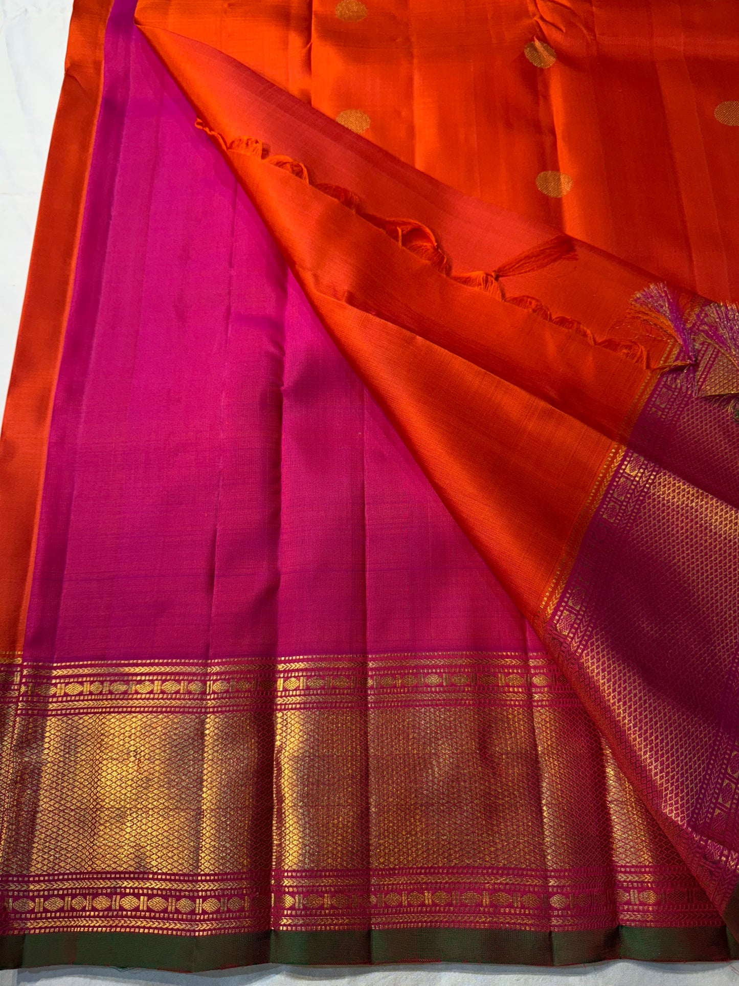 Kalpana
Pure Silk Kanchipuram Saree
Burnt Orange with Golden Buttas
Intricate Magenta & Gold Zari Border