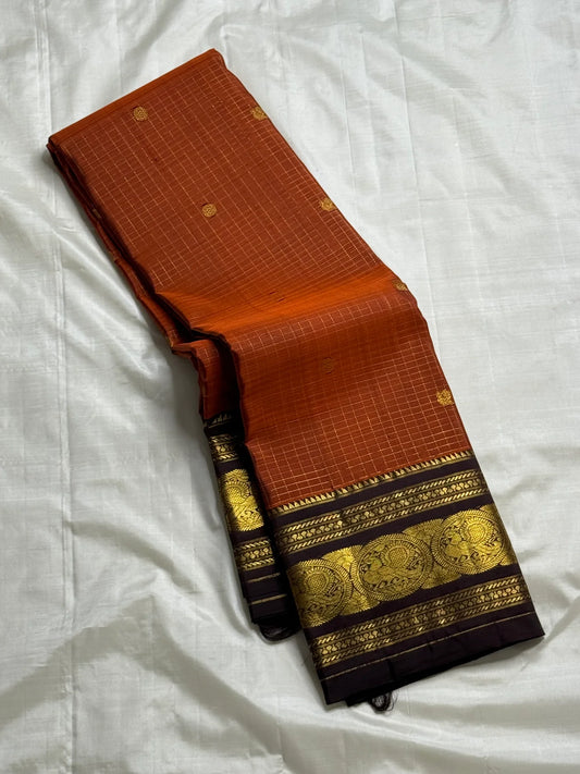 Kokilam — Rust Orange Pure Silk Kanchipuram Saree
Korvai contrast border in deep coffee brown with peacock medallions & gold brocade pallu
Silk Mark Certified ✅ • Free Shipping within USA 🇺🇸 • Ships in Two Weeks ✨