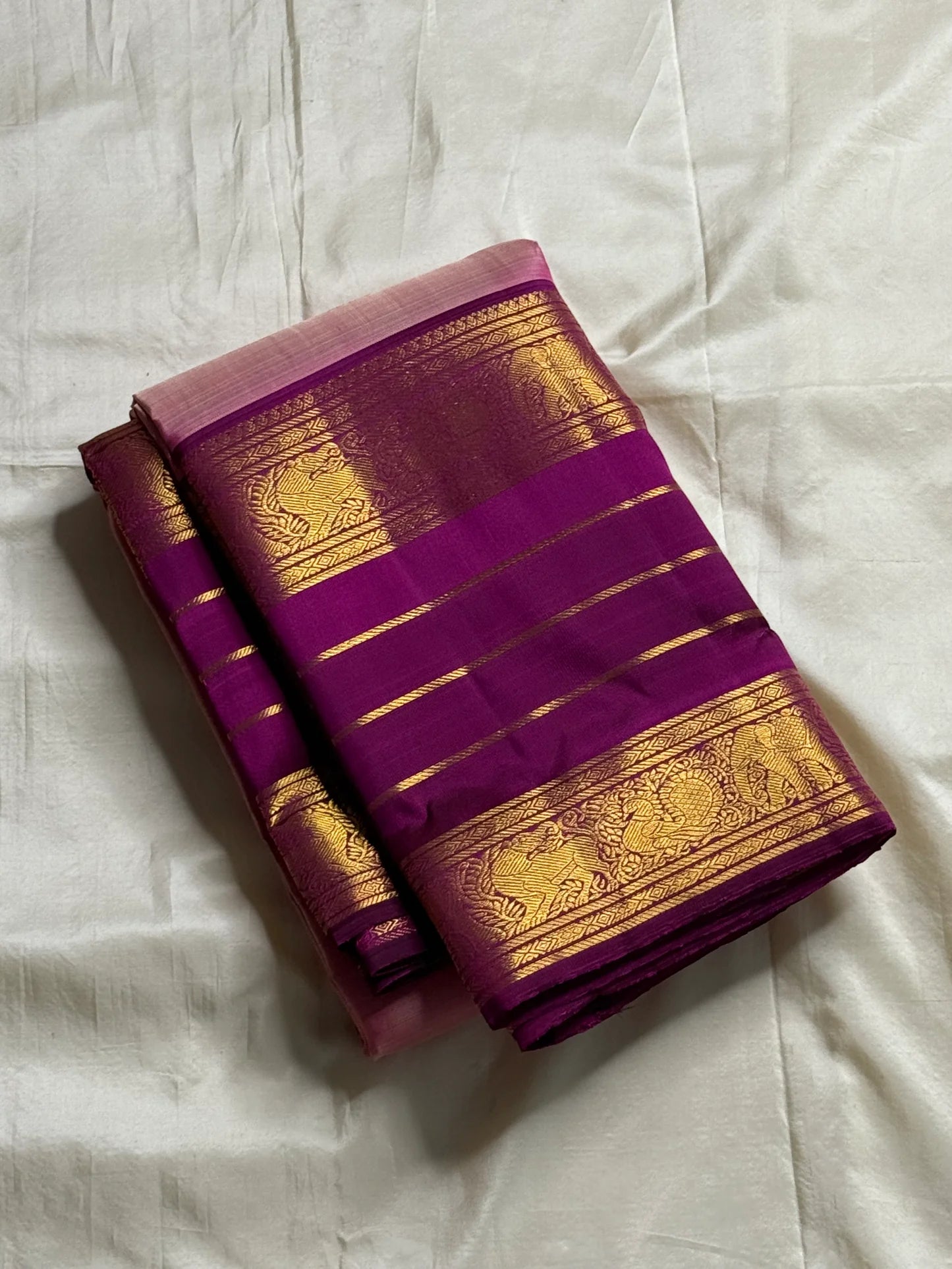 Swarna Sugantham — Pure Silk Kanchipuram Saree
Ombre rose-to-blush pink body with zari paisley buttas and rich rani-magenta borders in gold vine motifs.
Silk Mark Certified • Blouse Stitching Available ($30) • Free USA Shipping • Ships in Two Weeks.