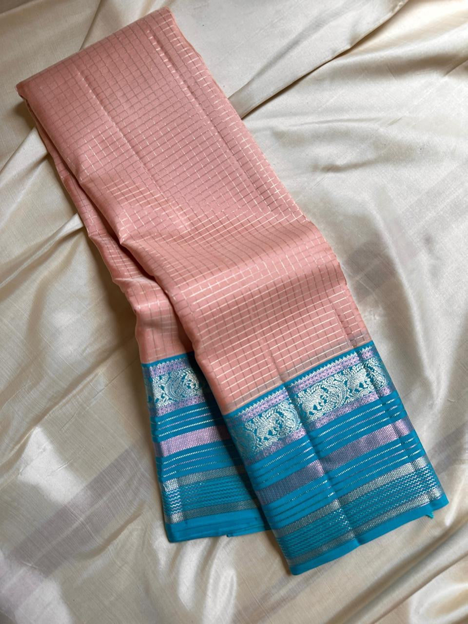 Most unique peach mocha and blue combination in pure silk Kanchipuram with Zari kattam and elephant motif border