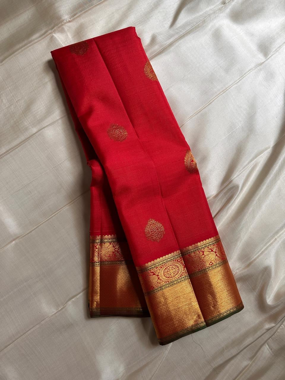 Nitya – Vibrant Red Pure Silk Kanchipuram Saree with Gold Vaira Oosi Stripes & Majestic Mayil Kamalam Border