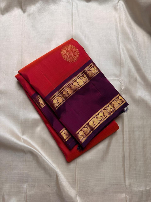 Bright marigold orange with purple rettapet border Mayil motif and beautiful mandala kamalam butta all over the pure silk Kanchipuram saree