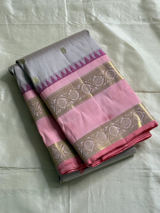 Pink pearl - Pure Kanchipuram Silk with petite chakram zari buttas
Contrast rose-pink border with magenta temple (reku) peaks & floral vine zari
Silk Mark Certified • Free USA Shipping • Ships in Two Weeks
