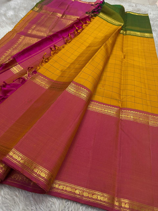 Kesari Checks — Pure Silk Kanchipuram Saree (almost -Mubbagam)
Saffron yellow body in grid kattam weave with radiant pink borders and zari detailing
Silk Mark Certified ✅ • Free USA Shipping • Ships in Two Weeks