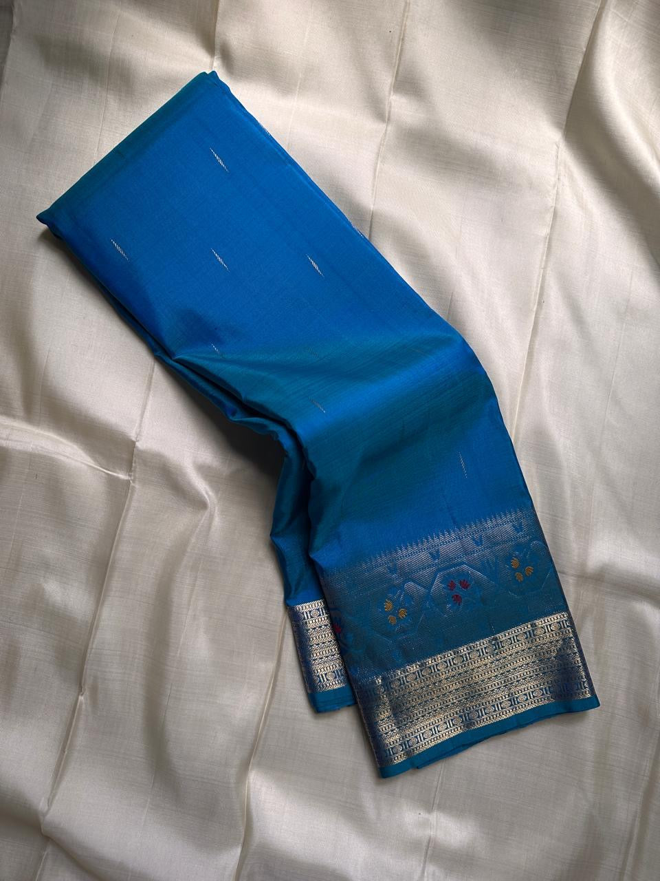Vibha peacock blue green shot double color Pure Kanchipuram Silk Saree Blending the Grandeur of South Indian Weaving with Paithani-Inspired Floral Zari Borders and a Lustrous Rose Gold zari Pallu