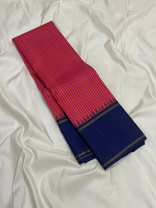 Peony Indigo Kattam — Pure Silk Kanchipuram Saree
Peony-Pink & Kesari Micro Checks with Deep Indigo Korvai Border ✨
Silk Mark Certified • Free USA Shipping • ships in two weeks ✅
