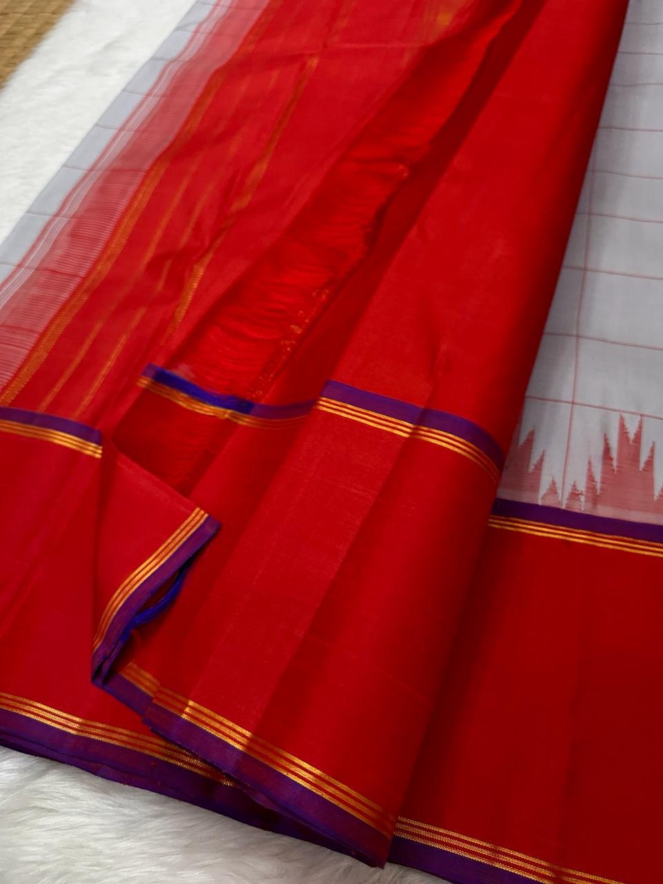 Tazhampoo 🌸 – Blue Kanchipuram Pure Silk Saree
Thazampoo Reku in Bright Orange-Red Border
Purple Selvedge for Vibrant Contrast
Handwoven in Our Family Village, Kanchipuram
Silk Mark Certified | Blouse fabric Included |stitching Available