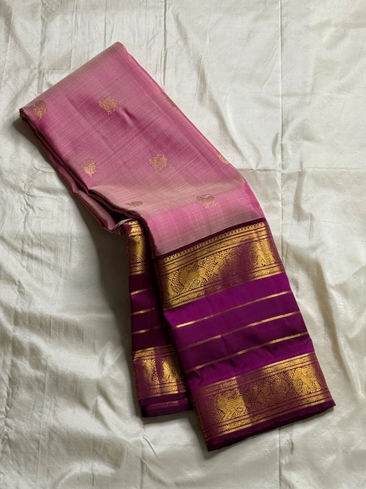 Swarna Sugantham — Pure Silk Kanchipuram Saree
Ombre rose-to-blush pink body with zari paisley buttas and rich rani-magenta borders in gold vine motifs.
Silk Mark Certified • Blouse Stitching Available ($30) • Free USA Shipping • Ships in Two Weeks.