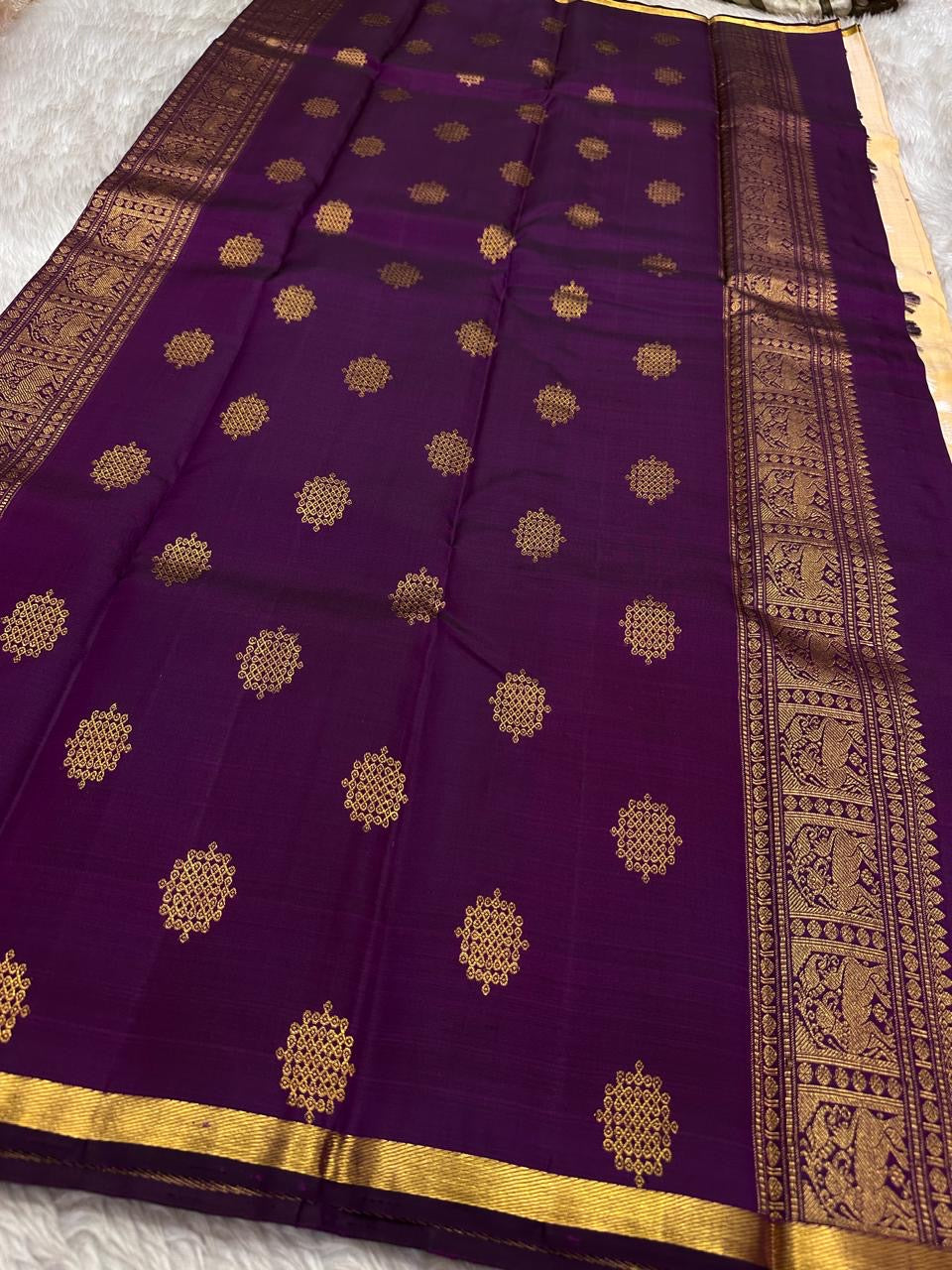 Half white cream purple selvedge and border with overall kolam woven motif in pure silk Kanchipuram saree