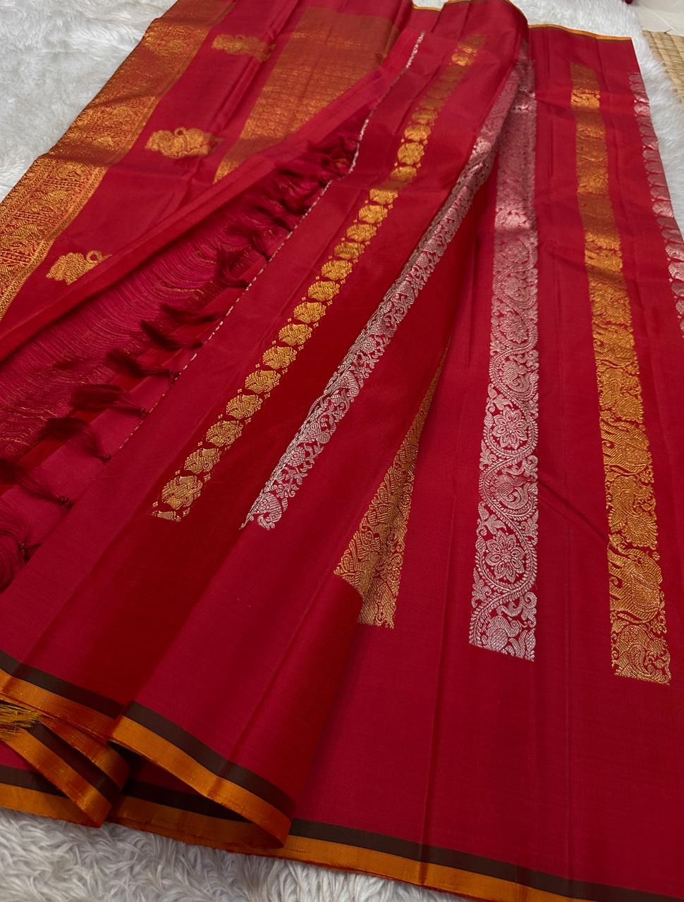Lavanya– Vermillion Red Handwoven Kanchipuram Silk Saree in red with Gold & Silver Zari, this deep red Kanchipuram silk saree with intricate motifs in gold and silver zari, including Gandaberunda, parrots, elephants &lotuses as seen on Nita Ambani