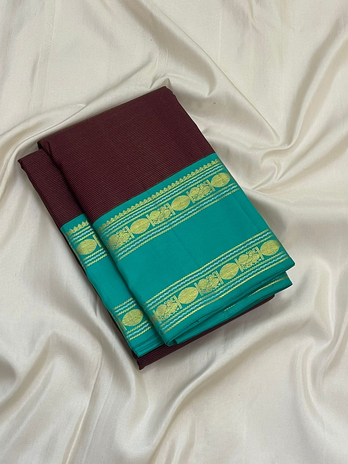 Pure Kanchipuram silk saree in deep brown and fresh teal with classic gold zari weaving