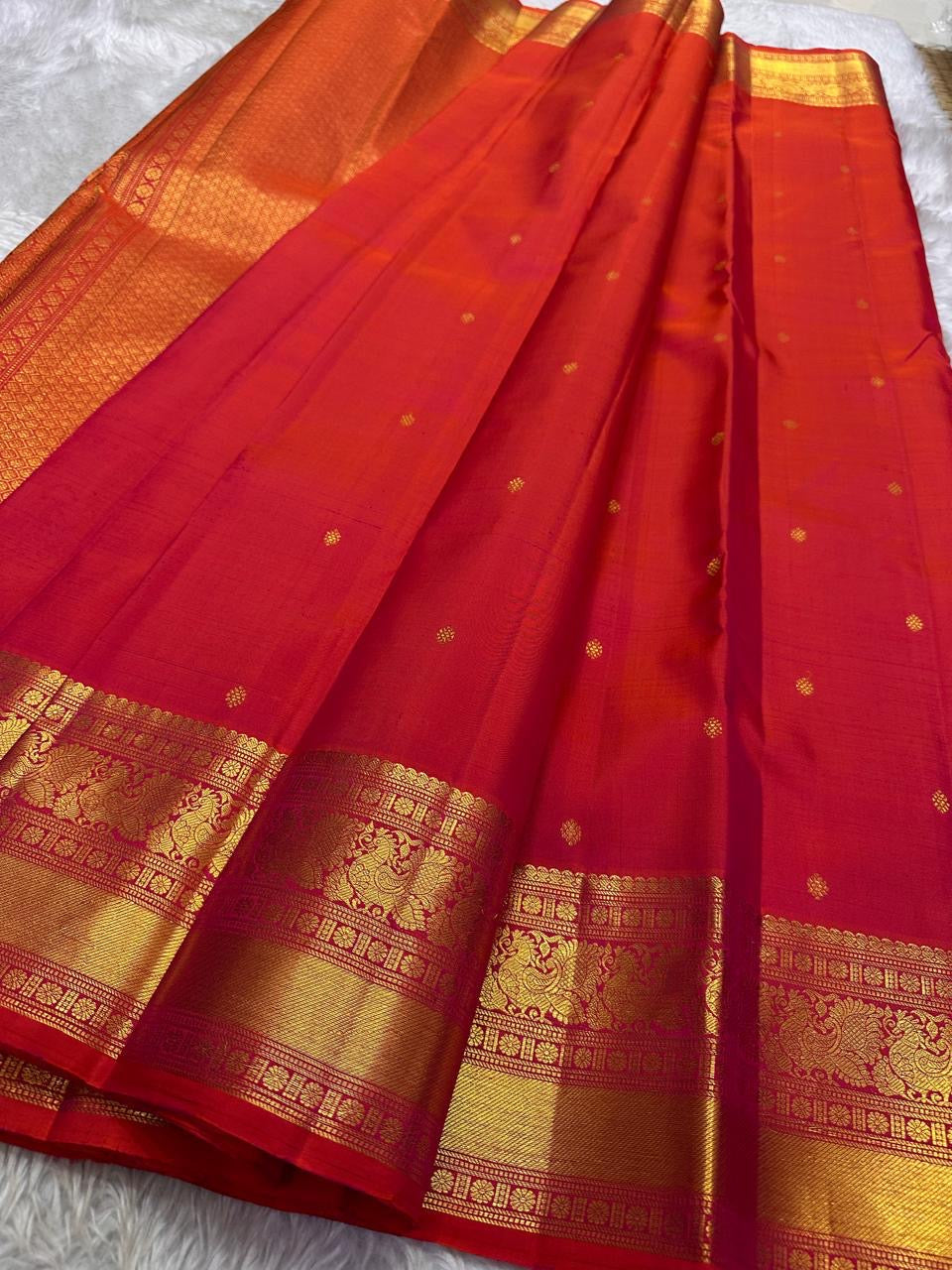 Fiery orange red shot double color small flower motif with vanasringaram and Rudhraksham border pure silk mark certified Kanchipuram saree