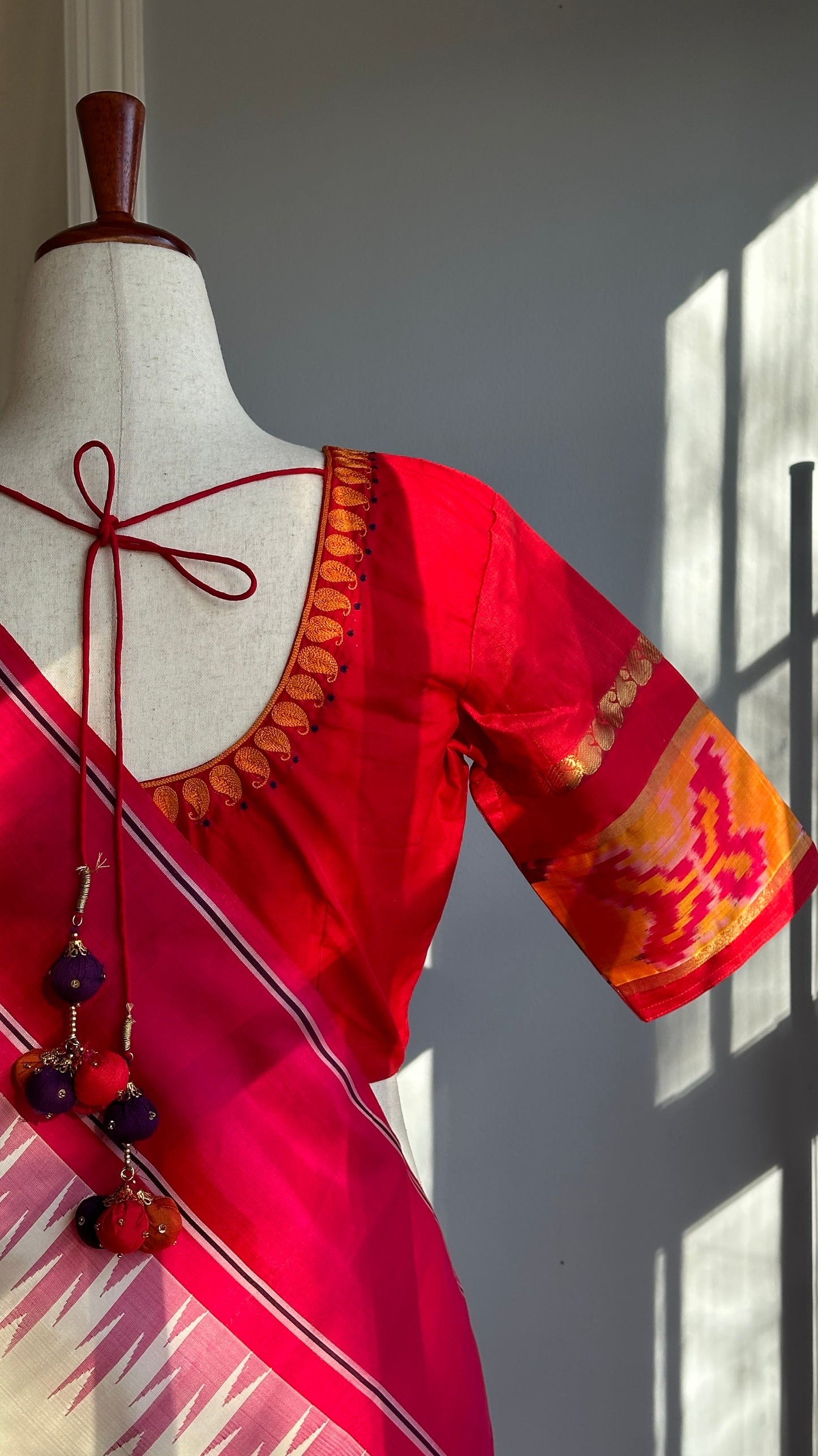 "shree" collection - pure silk embroidery blouse with chosen motifs in ikat silk orange red and purple