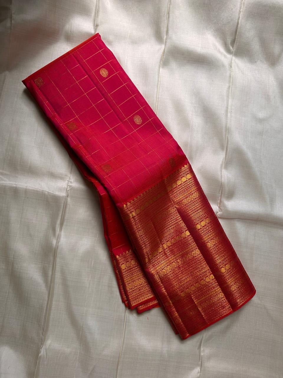 Orange red shot Zari kattam with ornate border pure silk Kanchipuram with mayil chakram zari butta and detailed Pallu
