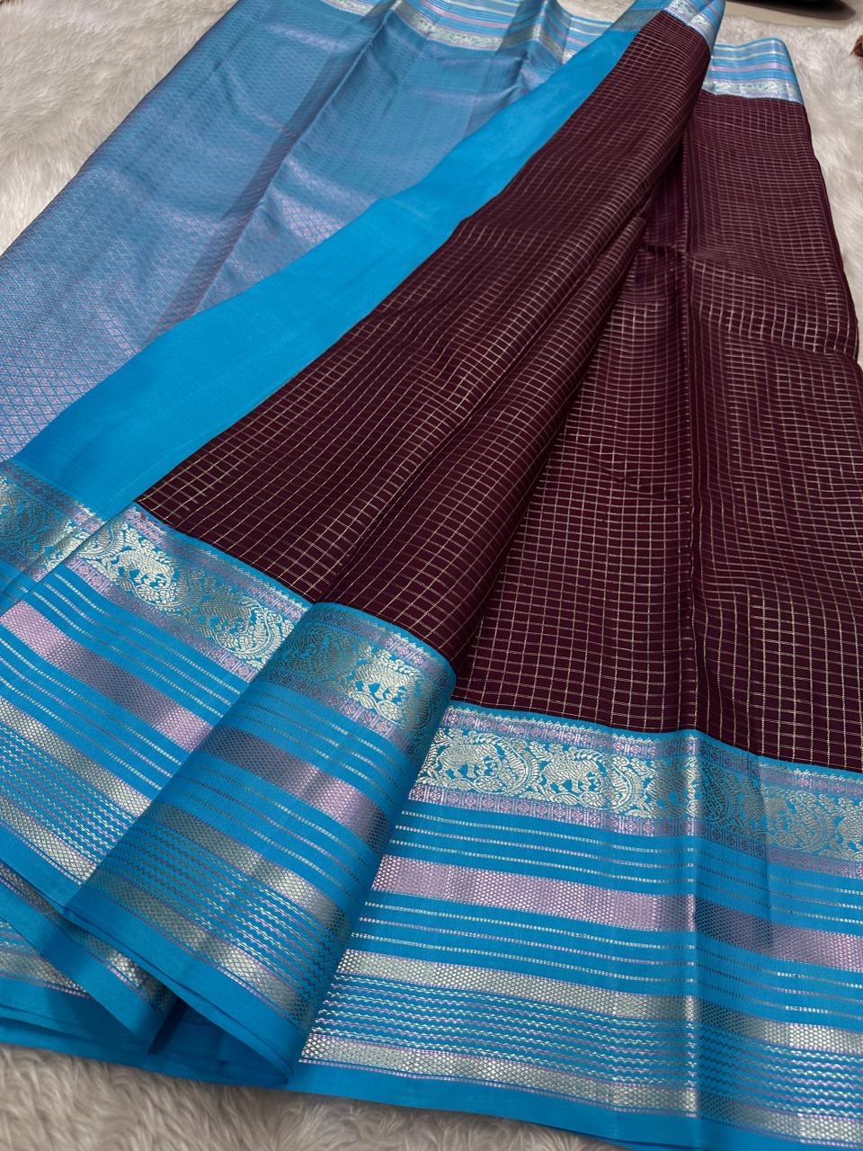 Most unique brown and blue combination in pure silk Kanchipuram with Zari kattam and elephant motif border