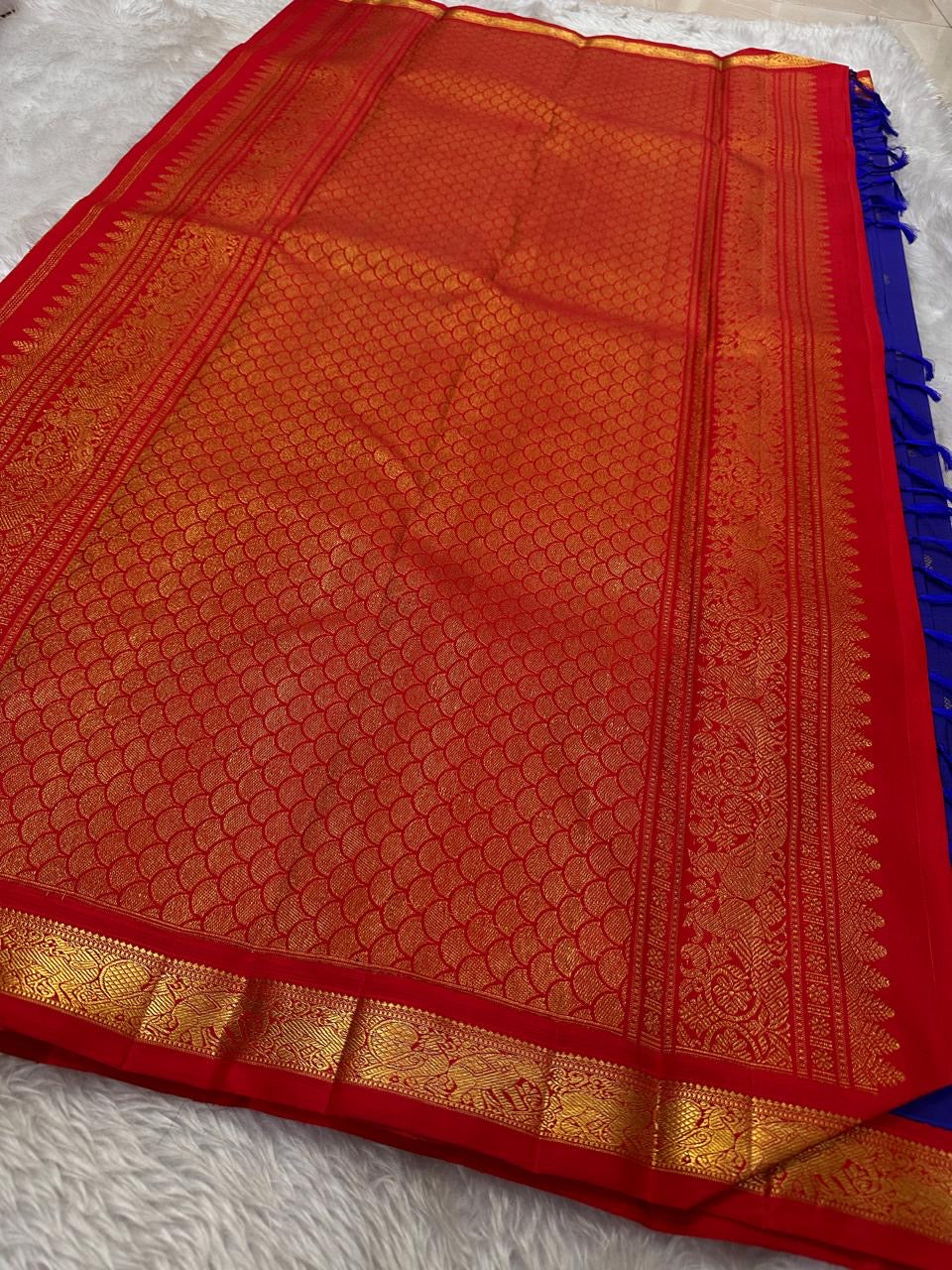 Pure silk Zari kattam butta pink and red saree with peacock, kamalam and kolam motifs
