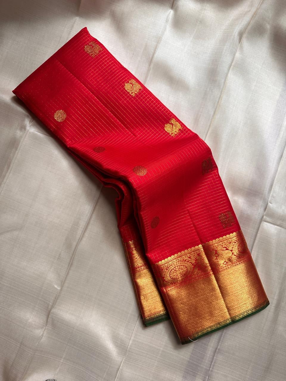 Ravi Kiranam Red Zari Kattam | Pure Silk Kanchipuram
Fiery Kumkum-Red • zari  Checks & Zari Buttas
Grand Gold Zari Border • Brocade Pallu with Ornamental Medallions
Silk Mark Certified • Free Shipping within USA
Ships in Two Weeks | Blouse Stitc
