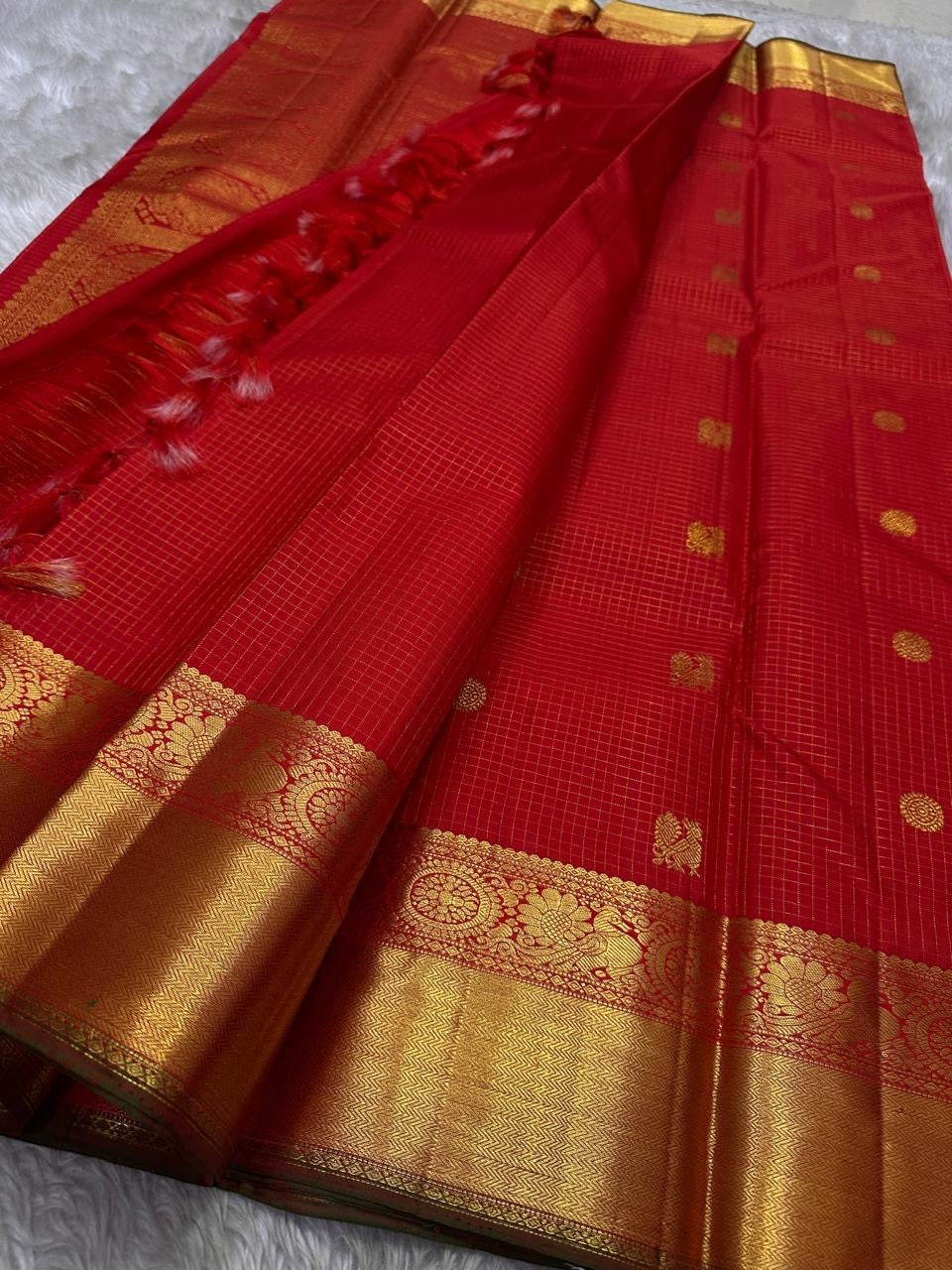 Ravi Kiranam Red Zari Kattam | Pure Silk Kanchipuram
Fiery Kumkum-Red • zari  Checks & Zari Buttas
Grand Gold Zari Border • Brocade Pallu with Ornamental Medallions
Silk Mark Certified • Free Shipping within USA
Ships in Two Weeks | Blouse Stitc