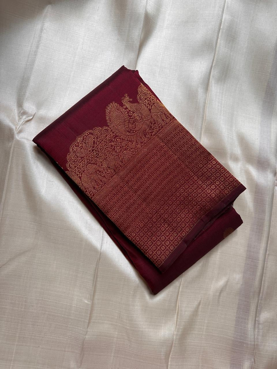 Lotus Glow — Maroon Brown | Pure Kanchipuram Silk Saree
A rich maroon-brown canvas with gold zari peacocks, elephants & lotus motifs 🌸
Silk Mark Certified • Free USA Shipping • Ships in Two Weeks