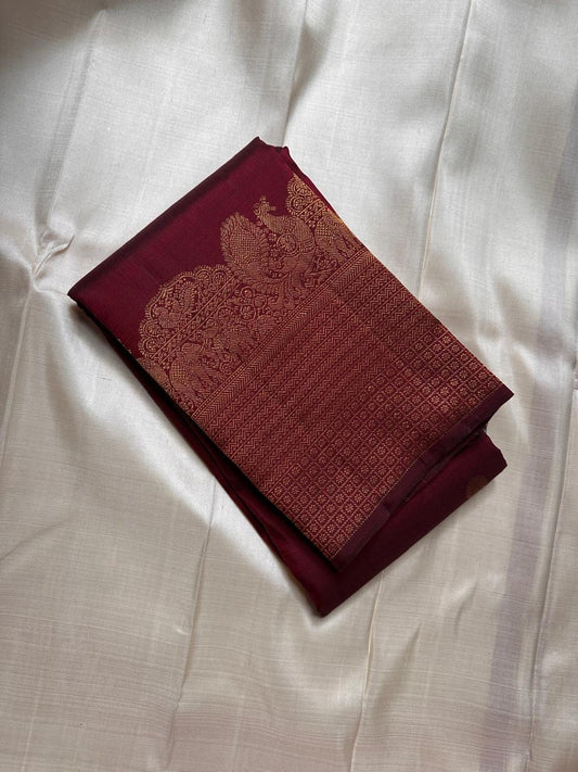 Lotus Glow — Maroon Brown | Pure Kanchipuram Silk Saree
A rich maroon-brown canvas with gold zari peacocks, elephants & lotus motifs 🌸
Silk Mark Certified • Free USA Shipping • Ships in Two Weeks