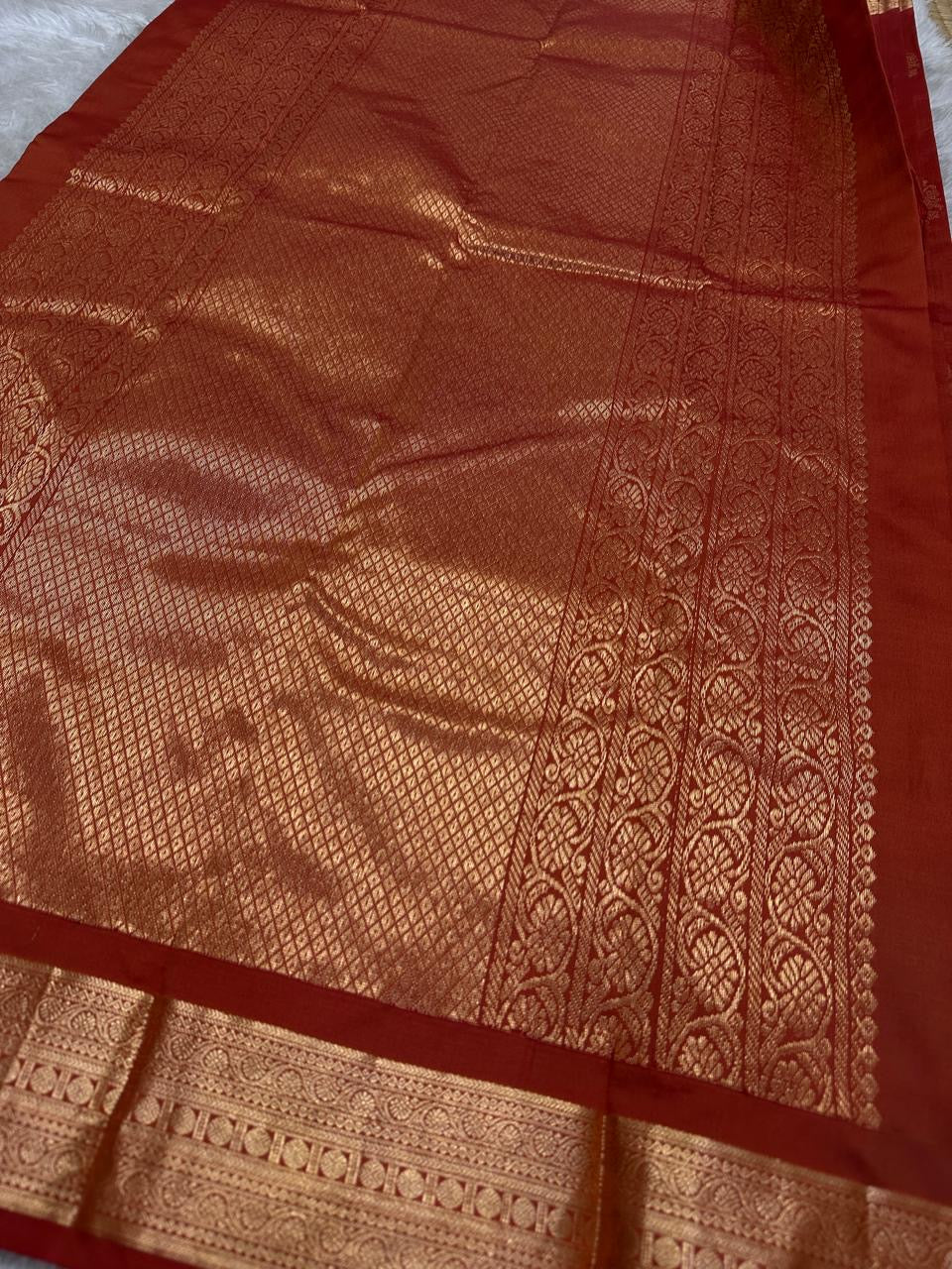 Thamarai — Copper Brown — Pure Kanchipuram Silk Saree
Copper Brown with Gold Zari Leaf Buttas & Diamond Jaal Pallu
Silk Mark Certified • Free Shipping within USA • Ships in Two Weeks