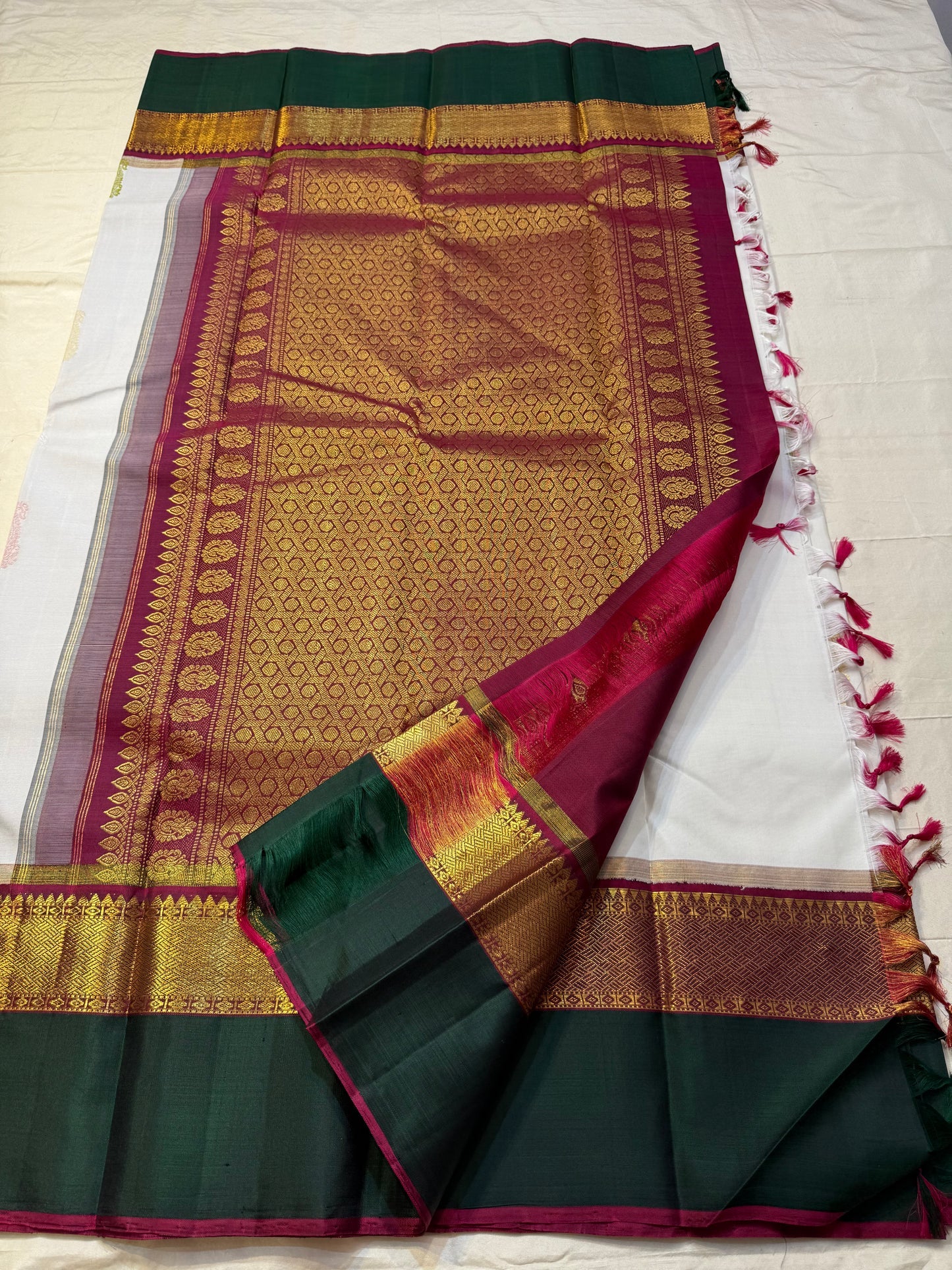Ivory Malligai — Pure Silk Kanchipuram Saree
Ivory body with multi-color paisley buttas and gold zari diamond border
Arakku pallu with floral zari weave | Silk Mark Certified | Ships in Two Weeks | Free USA