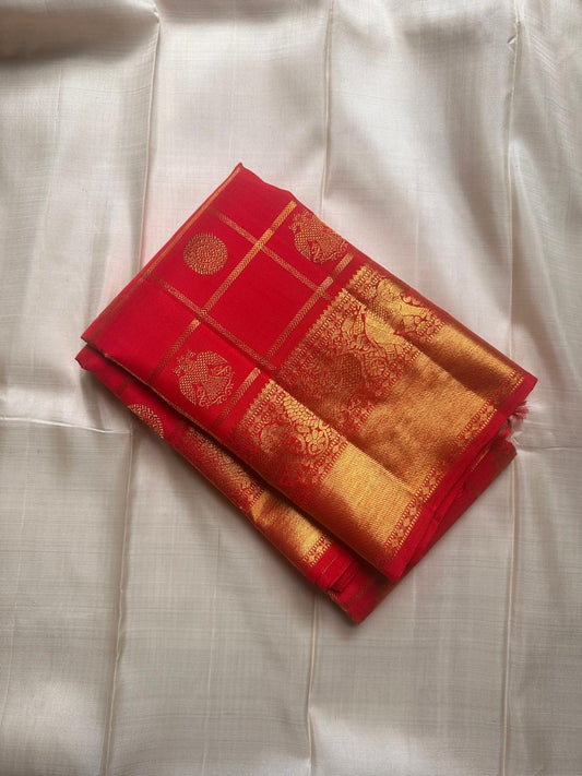 Ambaram – Sindhuram - Silk mark certified Kanchipuram silk
Elephant Procession Zari Border • Coin & Gandaberunda Buttas
Copper-Orange Brocade Pallu with Diamond-Jaal
Handloom • Running Red Blouse with Zari Border
Silk Mark Certified • Ships in Two Wee