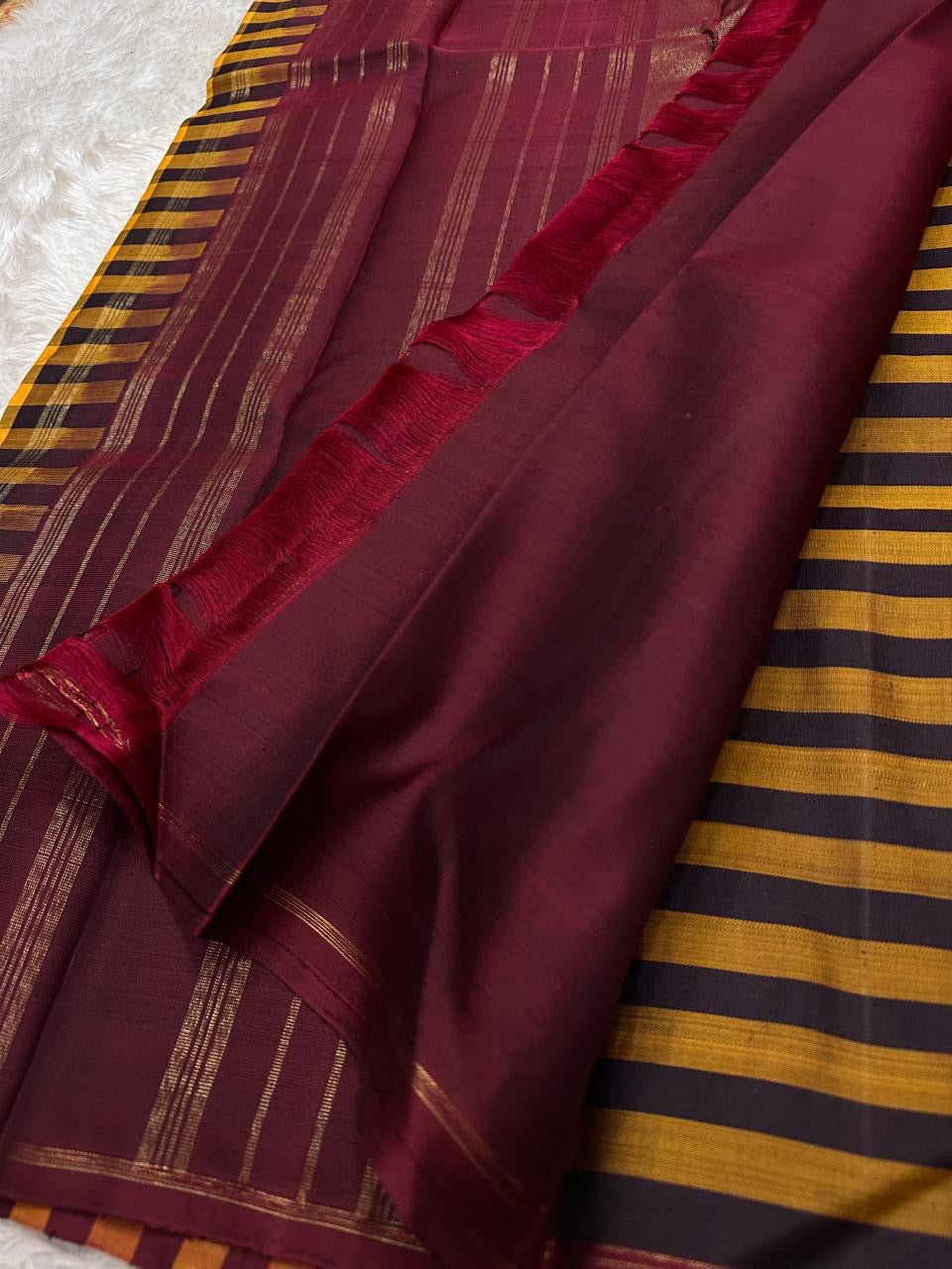 Kanchi kattam mustard and brown checked saree with deep maroon Pallu, Kai korvai