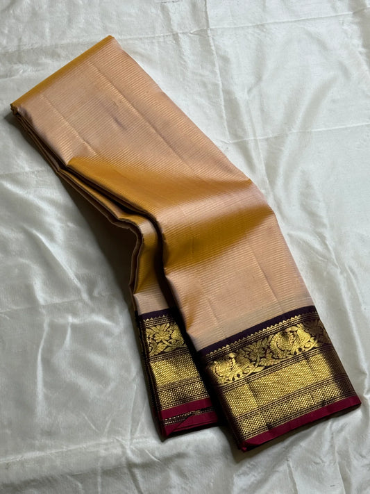 Butterscotch Vairaoosi — Pure Silk Kanchipuram Saree
Sand–butterscotch vaira oosi body • Maroon–plum korvai borders • Antique gold zari floral & peacock weave
Silk Mark Certified ✅ • Fall & Pico Done ✅ • Blouse Stitching Available ($30) ✅ • Ships in Two W