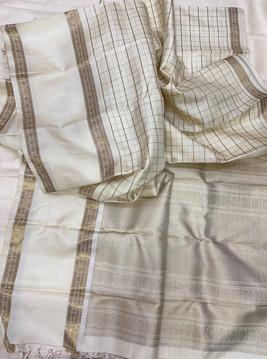 Swarna Kattam — Pure Silk Kanchipuram Saree
Ivory–gold body with zari kattam checks & rich pallu ✨
Silk Mark Certified • Ships in Two Weeks • Free Shipping within USA