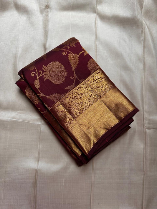 Coffee Blossom — Deep Maroon & Antique Gold Korvai
Pure Silk Kanchipuram Saree with Sevvanthi Floral Jaal & Yali Border
Grand Zari Pallu • Contrast Maroon Blouse with Border (Unstitched)
Silk Mark Certified ✅ Fall & Pico Done ✅ Blouse Stitching Available
