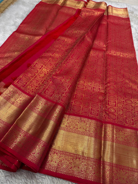 Ruby Grid – Pure Kanchipuram Silk Saree with Pure 4G Zari Kattam
bridal red body woven with luminous pure zari checks ✨
kattam tiles filled with lotus, paisley & chakra buttas 🌸
pure zari border and pallu, Silk Mark Certified, delivery in 2 weeks