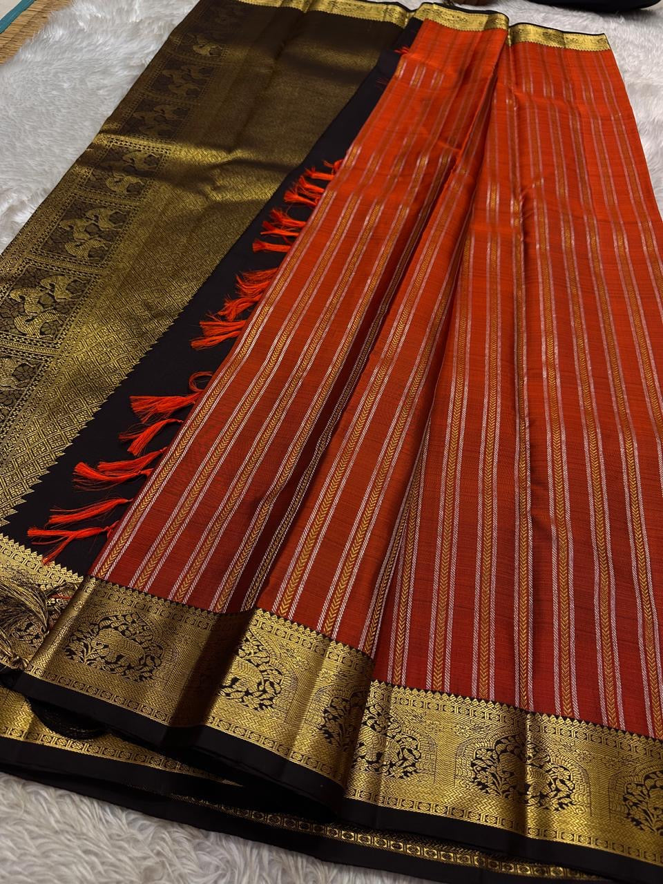 Tamra — Rust Vairaoosi Kanchipuram Pure Silk
 
Coffee Brown Korvai Border & zAri Pallu
 
elephant motifs  Medallions & Annam Panels in Gold Zari
 
Silk Mark Certified | Free Shipping within USA
 
Ships in Two Weeks | Blouse Stitching $30