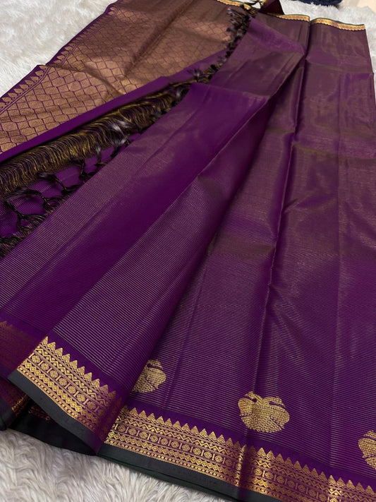 Purple Gandaberunda Vairaoosi — Pure Silk Kanchipuram Saree
Royal purple vairaoosi stripes with antique-gold Gandaberunda buttas & temple border.
Silk Mark Certified · Free USA Shipping · Ships in 2 Weeks ✨