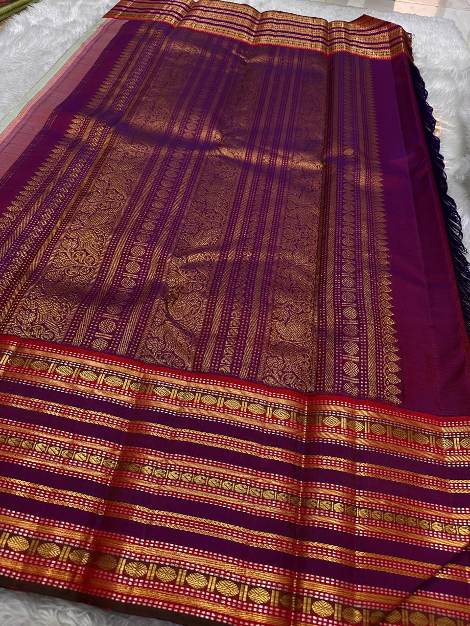 Pure silk kanchipuram grey with sampanga green vairaoosi with detailed ornate varisaipet border thandavalam zari , mayil Butta