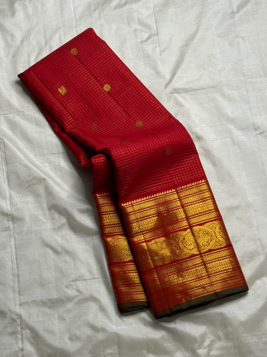 Chandrika — Pure Silk Kanchipuram Saree
Kumkum Red Body with Gold Checks & Coin Buttas | Grand Zari Medallion Borders
Rich Brocade Pallu | Silk Mark Certified ✅ | Free USA Shipping | Ships in Two Weeks ✅