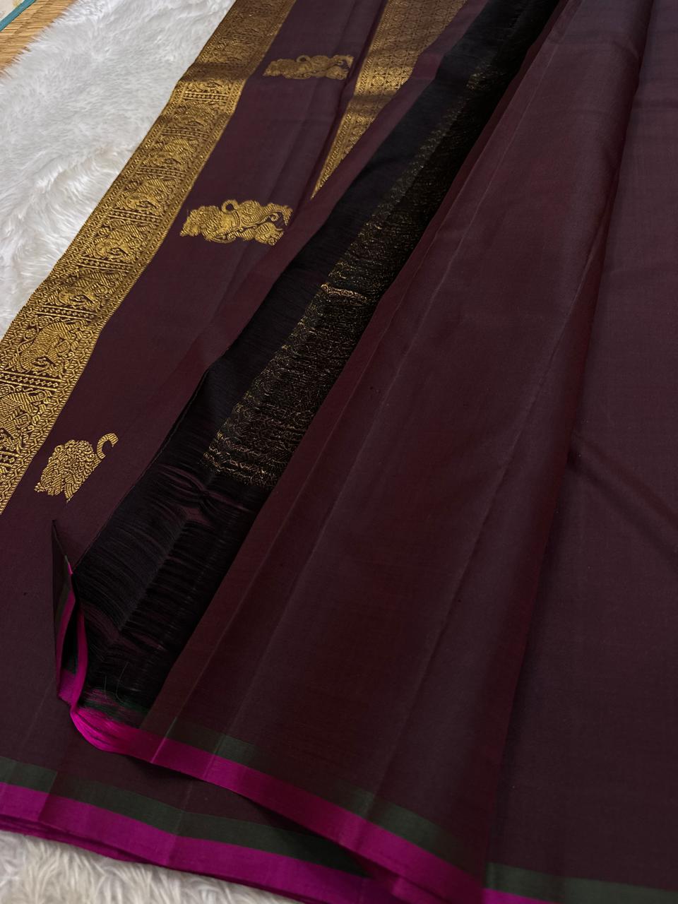 Lavanya– deep brown Handwoven Kanchipuram Silk Saree in Brown with Gold & Silver Zari, this deep brown Kanchipuram silk saree with intricate motifs in gold and silver zari, including Gandaberunda, parrots, elephants &lotuses as seen on Nita Ambani