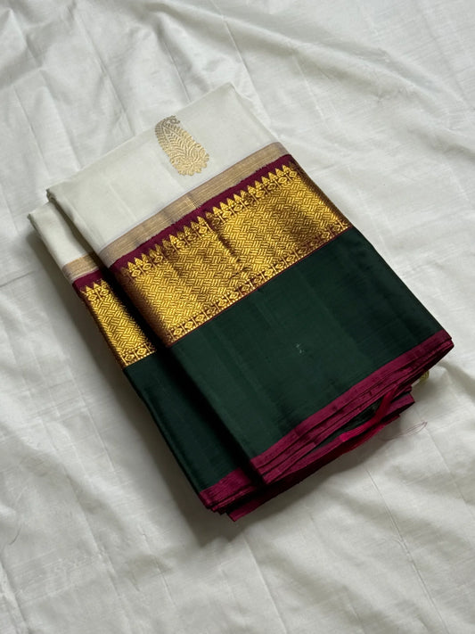 Ivory Malligai — Pure Silk Kanchipuram Saree
Ivory body with multi-color paisley buttas and gold zari diamond border
Arakku pallu with floral zari weave | Silk Mark Certified | Ships in Two Weeks | Free USA