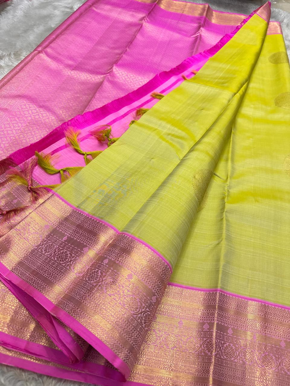 Lotus Lime Kanchipuram silk saree with lime-green body, rani pink korvai border, and grand zari brocade pallu. Silk Mark Certified. Free USA Shipping. Ships in two weeks.