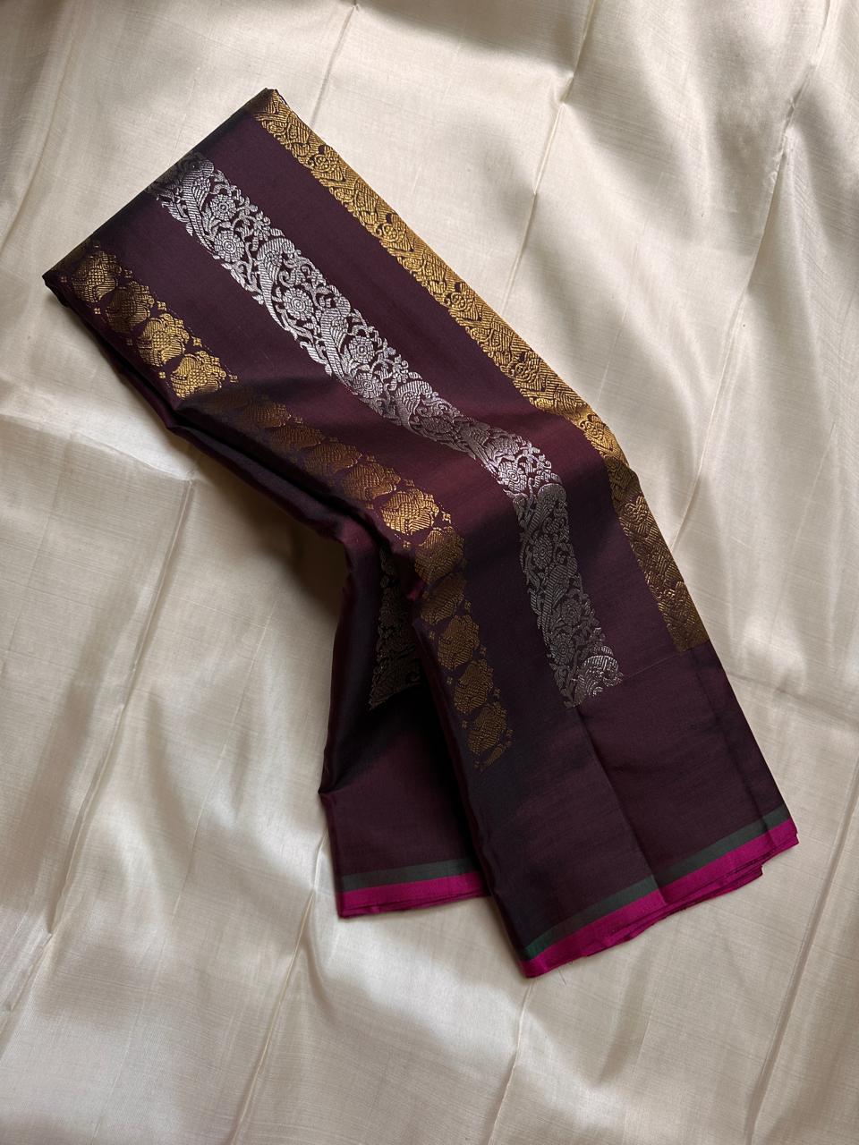 Lavanya– deep brown Handwoven Kanchipuram Silk Saree in Brown with Gold & Silver Zari, this deep brown Kanchipuram silk saree with intricate motifs in gold and silver zari, including Gandaberunda, parrots, elephants &lotuses as seen on Nita Ambani