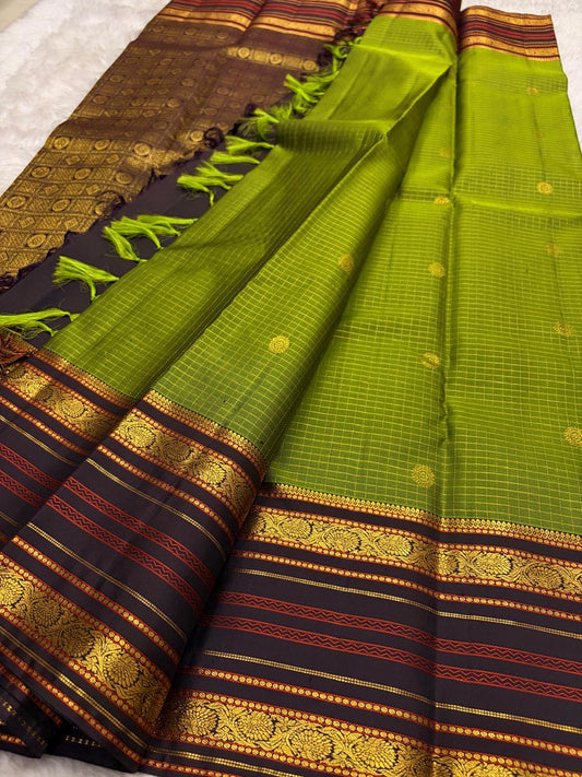 Handwoven Kanjeevaram Varisaipet saree featuring olive green body and striking charcoal border