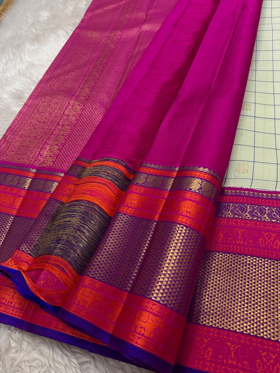 Pastel green pistachio with kungumam red and royal blue border dark blue silk thread checks mayil chakram butta magenta detailed Pallu