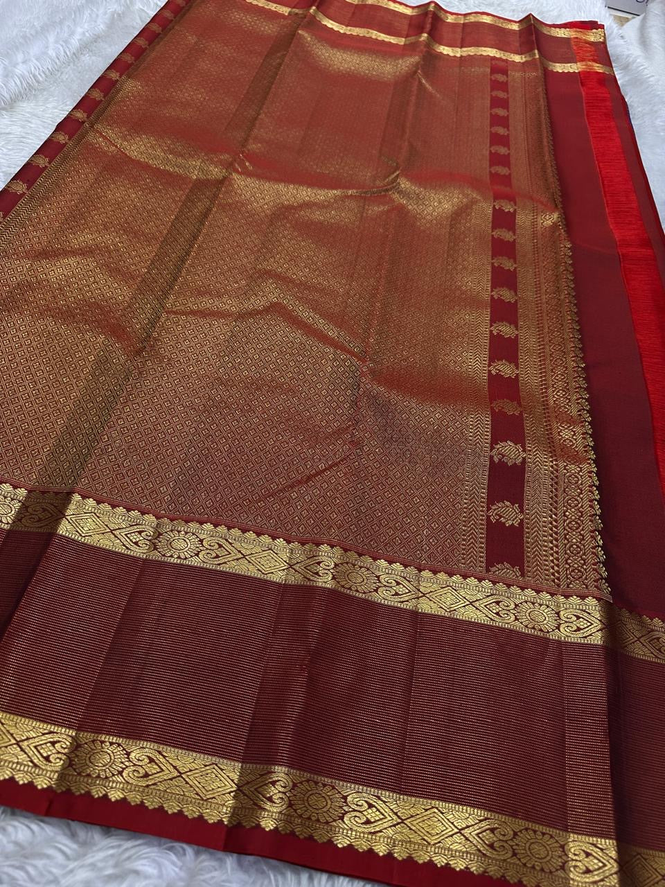 Sapphire Ruby Kattam – Pure Kanchipuram Silk Saree
sapphire blue body with gold kattam checks & buttas
Contrast ruby-red korvai borders with intricate gold zari weave
Grand ruby-red pallu with floral motifs
Silk Mark Certified | ships in 2 weeks
