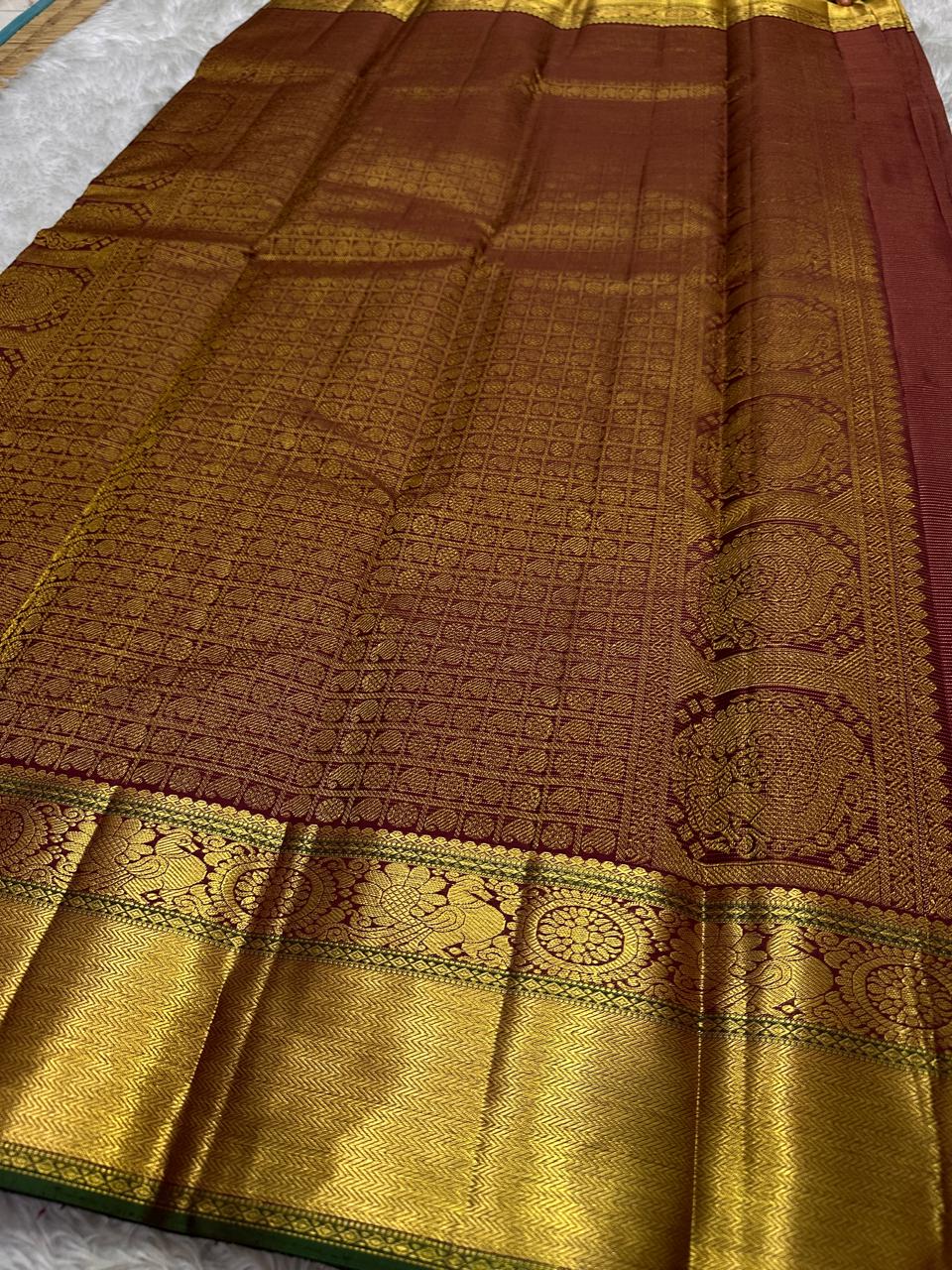 Burgundy Vairaoosi – Pure Kanchipuram Silk Saree
Classic burgundy body woven with Vairaoosi ✨
with delicate gold floral medallion buttas for temple elegance
antique-gold korvai borders with rosettes & chevron. Silk Mark Certified, delivery in 2 weeks