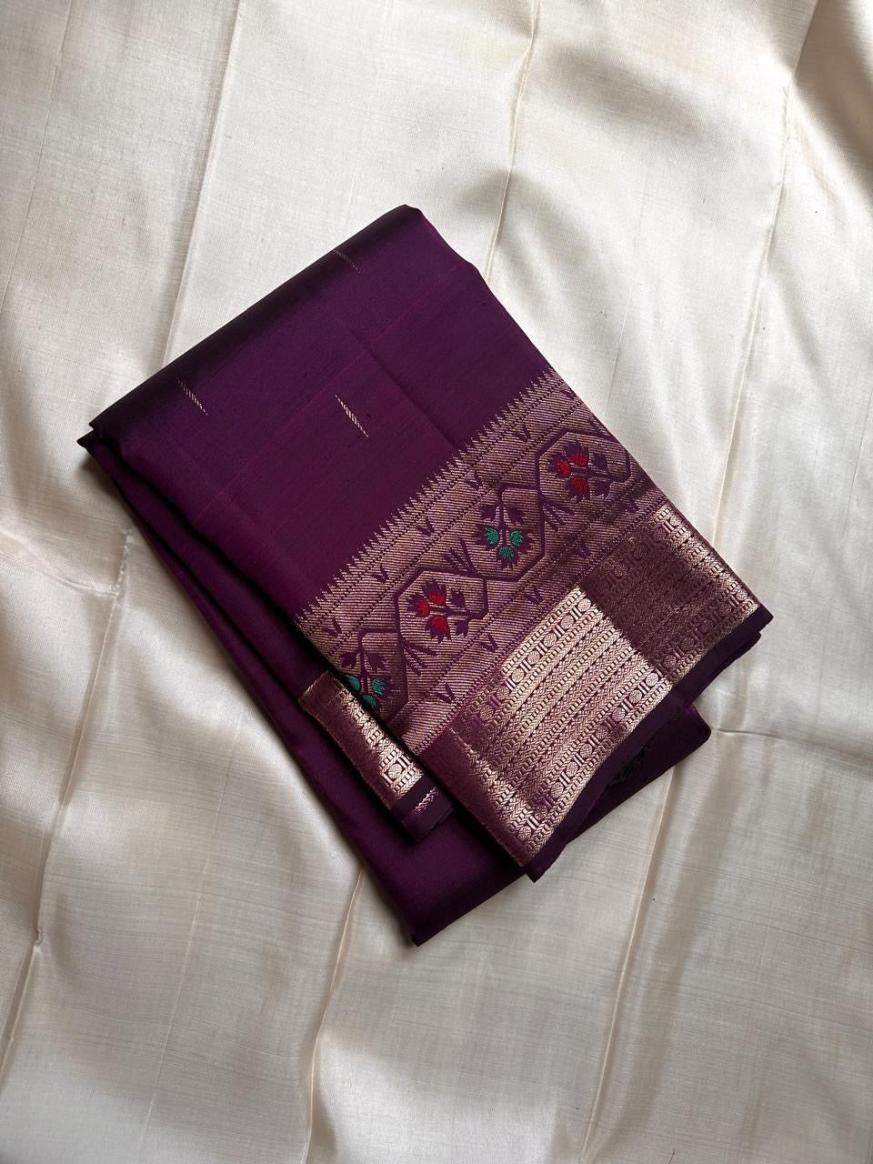 Vibha plum - A Deep Plum Pure Kanchipuram Silk Saree Blending the Grandeur of South Indian Weaving with Paithani-Inspired Floral Zari Borders and a Lustrous Rose Gold zari Pallu