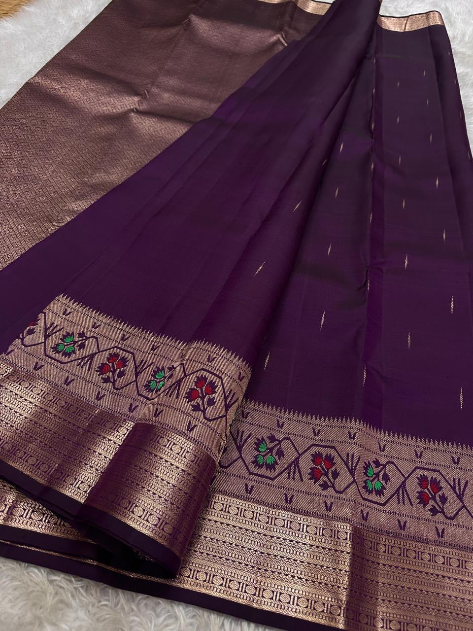 Vibha plum - A Deep Plum Pure Kanchipuram Silk Saree Blending the Grandeur of South Indian Weaving with Paithani-Inspired Floral Zari Borders and a Lustrous Rose Gold zari Pallu