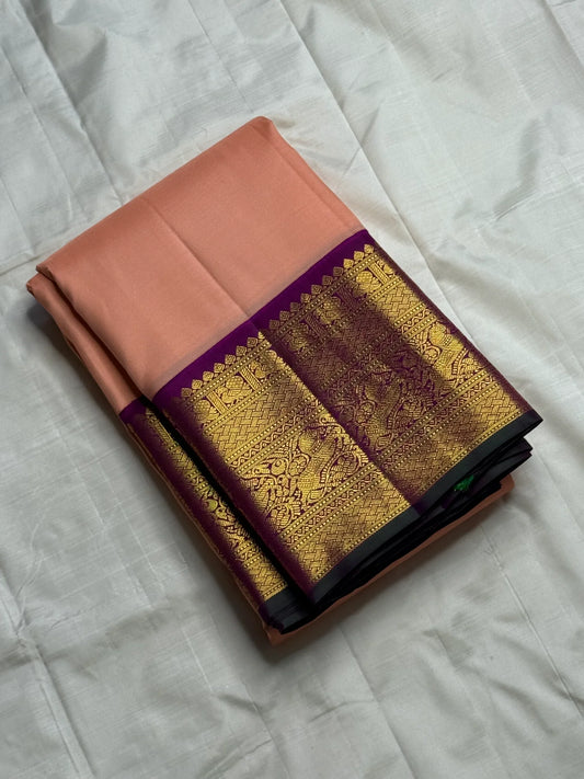 Apricot Yazhi — Pure Silk Kanchipuram Saree
Soft apricot-peach body with royal-purple korvai border featuring antique-gold Yazhi & Mayil motifs and temple edges.
Silk Mark Certified • Blouse Stitching ($30) • Free USA Shipping • Ships in 2 Weeks