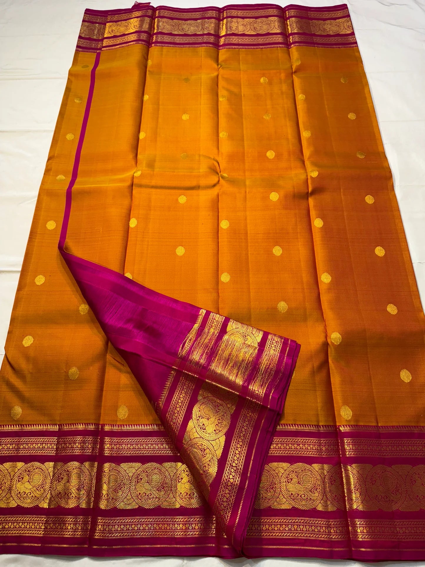 Rust Orange Pink Radiance — Pure Silk Kanchipuram
Earthy rust-orange body with gold coin buttas & rani pink korvai border in grand zari medallions
Silk Mark Certified • Free USA Shipping • Ships in Two Weeks ✅