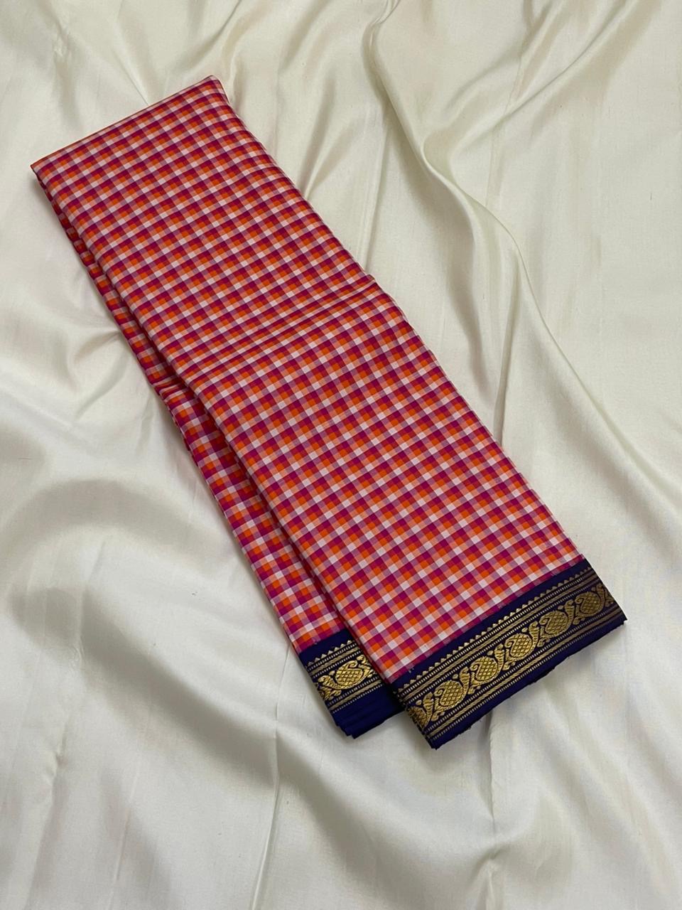 Rani Kanthi — Pure Silk Kanchipuram Saree
Sunset-orange, rani-pink & haldi-yellow kattam checks ✨
Navy korvai borders with intricate gold zari vines
Rich navy pallu with zari pinstripes & tasseled finish
Silk Mark Certified • Free USA Shipping in 1 week